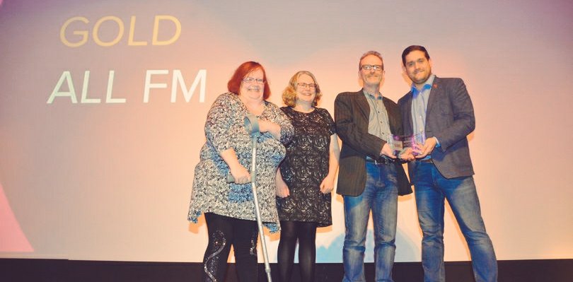 Community radio station ALL FM winninig award on stage